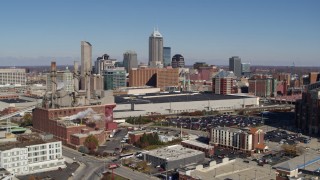 DX0001_002809 - 5.7K aerial stock footage approach brick factory, convention center and city skyline, Downtown Indianapolis, Indiana