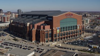 DX0001_002813 - 5.7K aerial stock footage of a reverse view of a football stadium in Indianapolis, Indiana