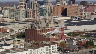 5.7K aerial stock footage of descending by brick factory with smoke stacks in Indianapolis, Indiana Aerial Stock Footage | DX0001_002819