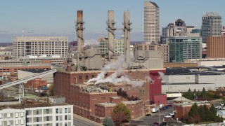 5.7K aerial stock footage of flying by brick factory with smoke stacks in Indianapolis, Indiana Aerial Stock Footage | DX0001_002820