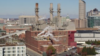 5.7K aerial stock footage of passing by brick factory with smoke stacks in Indianapolis, Indiana Aerial Stock Footage | DX0001_002821