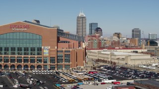 5.7K aerial stock footage flyby tall skyscrapers in the city's skyline and football stadium in Downtown Indianapolis, Indiana Aerial Stock Footage | DX0001_002828