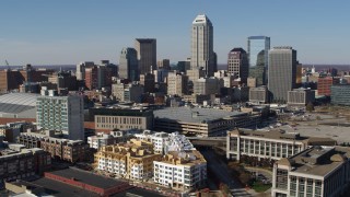 5.7K aerial stock footage descend while focusing on the city's skyline in Downtown Indianapolis, Indiana Aerial Stock Footage | DX0001_002843