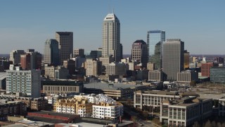 5.7K aerial stock footage ascend to flyby tall skyscrapers in the city's skyline in Downtown Indianapolis, Indiana Aerial Stock Footage | DX0001_002856