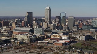 5.7K aerial stock footage of passing by tall skyscrapers in the city's skyline in Downtown Indianapolis, Indiana Aerial Stock Footage | DX0001_002858