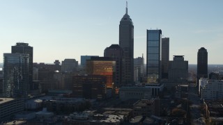 5.7K aerial stock footage ascend while flying by the towering skyscrapers in the city's skyline in Downtown Indianapolis, Indiana Aerial Stock Footage | DX0001_002868