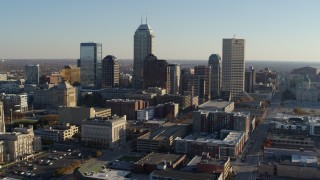 5.7K aerial stock footage of passing by the skyline in Downtown Indianapolis, Indiana and ascend Aerial Stock Footage | DX0001_002893