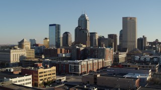 5.7K aerial stock footage of flying from the skyline's tall skyscrapers in Downtown Indianapolis, Indiana Aerial Stock Footage | DX0001_002900