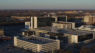 5.7K aerial stock footage of orbiting a large hospital complex at sunset in Indianapolis, Indiana Aerial Stock Footage | DX0001_002917