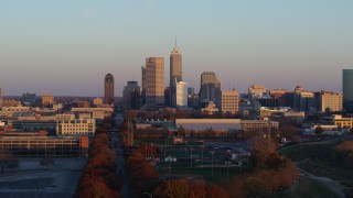 5.7K aerial stock footage of a wide view of the city's skyline at sunset, Downtown Indianapolis, Indiana Aerial Stock Footage | DX0001_002932