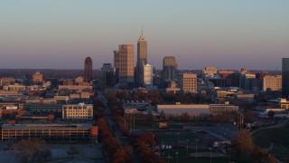 5.7K aerial stock footage descend with wide view of the city's downtown skyline at sunset, Downtown Indianapolis, Indiana Aerial Stock Footage | DX0001_002935