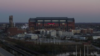 5.7K aerial stock footage slowly flyby a football stadium at sunset, Downtown Indianapolis, Indiana Aerial Stock Footage | DX0001_002952