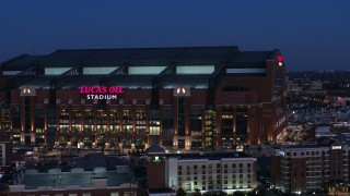 5.7K aerial stock footage approach the side of the football stadium at twilight, Indianapolis, Indiana Aerial Stock Footage | DX0001_002968