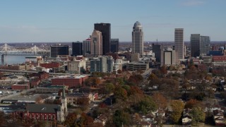 DX0001_002988 - 5.7K aerial stock footage ascend and approach skyscrapers in the city's skyline in Downtown Louisville, Kentucky