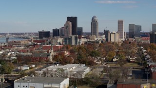 5.7K aerial stock footage ascend while passing by skyscrapers in the city's skyline in Downtown Louisville, Kentucky Aerial Stock Footage | DX0001_002990