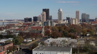 5.7K aerial stock footage flyby and focus on skyscrapers in the city's skyline before descent in Downtown Louisville, Kentucky Aerial Stock Footage | DX0001_002995