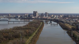 5.7K aerial stock footage of the city's skyline seen while passing by the river in Downtown Louisville, Kentucky Aerial Stock Footage | DX0001_003000