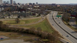 DX0001_003005 - 5.7K aerial stock footage track cars on a freeway in Louisville, Kentucky