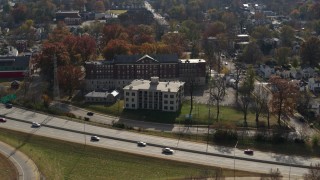 5.7K aerial stock footage flyby and away from a health clinic behind historic hospital in Louisville, Kentucky Aerial Stock Footage | DX0001_003007