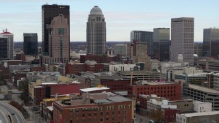 5.7K aerial stock footage flyby and away from city skyline seen from freeway offramp in Downtown Louisville, Kentucky Aerial Stock Footage | DX0001_003021