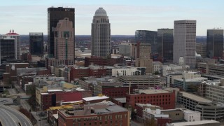 5.7K aerial stock footage ascend and approach the city skyline from freeway offramp in Downtown Louisville, Kentucky Aerial Stock Footage | DX0001_003022