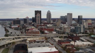 5.7K aerial stock footage flyby the city's skyline beside a freeway in Downtown Louisville, Kentucky before approach Aerial Stock Footage | DX0001_003029