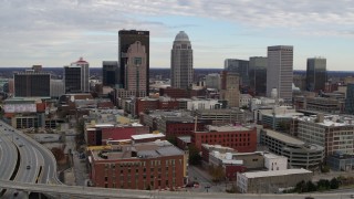 DX0001_003034 - 5.7K aerial stock footage slow approach to tall skyscrapers in city skyline in Downtown Louisville, Kentucky