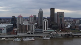 5.7K aerial stock footage fly away from riverfront hotel and skyline, reveal the river in Downtown Louisville, Kentucky Aerial Stock Footage | DX0001_003041