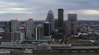 DX0001_003043 - 5.7K aerial stock footage approach riverfront hotel and the city skyline from the river in Downtown Louisville, Kentucky