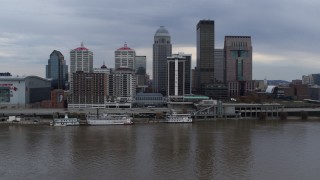 5.7K aerial stock footage descend while flying by the city skyline and Ohio River in Downtown Louisville, Kentucky Aerial Stock Footage | DX0001_003046