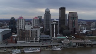 DX0001_003050 - 5.7K aerial stock footage reverse view of skyline and hotel, revealing the Ohio River in Downtown Louisville, Kentucky