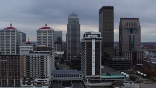 DX0001_003052 - 5.7K aerial stock footage fly away from skyscrapers behind riverfront hotel in Downtown Louisville, Kentucky