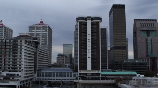 DX0001_003058 - 5.7K aerial stock footage descend and flyby hotel, skyscrapers in background, Downtown Louisville, Kentucky