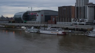 5.7K aerial stock footage reverse view of historic riverboat docked by Downtown Louisville, Kentucky Aerial Stock Footage | DX0001_003062