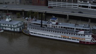 5.7K aerial stock footage close-up view of the historic riverboat docked by Downtown Louisville, Kentucky Aerial Stock Footage | DX0001_003064