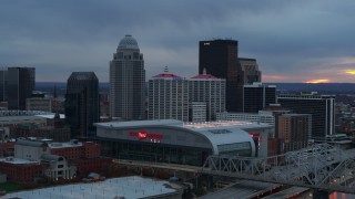 DX0001_003086 - 5.7K aerial stock footage flyby arena and city skyline at sunset, seen while passing bridge, Downtown Louisville, Kentucky