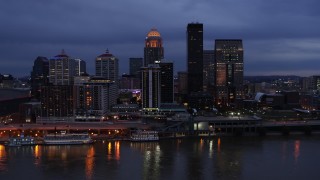 5.7K aerial stock footage of flying by the skyline at twilight, seen from Ohio River, Downtown Louisville, Kentucky Aerial Stock Footage | DX0001_003097