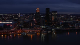 DX0001_003110 - 5.7K aerial stock footage slowly flyby the city's skyline at twilight, seen from across Ohio River, Downtown Louisville, Kentucky