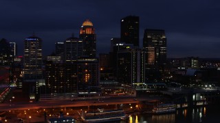 5.7K aerial stock footage reverse view of hotel and the city skyline at twilight, reveal river, Downtown Louisville, Kentucky Aerial Stock Footage | DX0001_003115