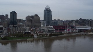 5.7K aerial stock footage slow pass over river with view of the baseball stadium and skyscraper, Downtown Cincinnati, Ohio Aerial Stock Footage | DX0001_003129