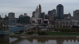 5.7K aerial stock footage descend and fly away from city skyline, seen from the Ohio River, Downtown Cincinnati, Ohio Aerial Stock Footage | DX0001_003132