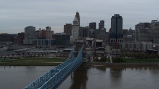 5.7K aerial stock footage ascend by bridge while focused on the city skyline, Downtown Cincinnati, Ohio Aerial Stock Footage | DX0001_003139