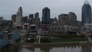 5.7K aerial stock footage fly over Ohio River to approach tall skyscraper, Downtown Cincinnati, Ohio Aerial Stock Footage | DX0001_003143