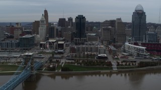 5.7K aerial stock footage slow pass by city skyline, seen from the Ohio River near bridge, Downtown Cincinnati, Ohio Aerial Stock Footage | DX0001_003145