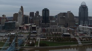 5.7K aerial stock footage ascend and fly away from city skyline, reveal the river, Downtown Cincinnati, Ohio Aerial Stock Footage | DX0001_003148