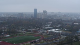 5.7K aerial stock footage reverse view of the city skyline seen from residential neighborhoods, Downtown Lexington, Kentucky Aerial Stock Footage | DX0001_003207