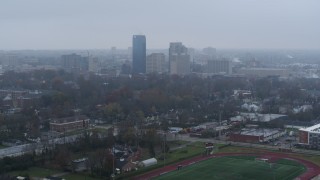 5.7K aerial stock footage slowly flying by the city skyline seen from residential neighborhoods, Downtown Lexington, Kentucky Aerial Stock Footage | DX0001_003208