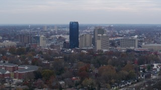 5.7K aerial stock footage focus on the city's skyline from tree-lined neighborhoods, Downtown Lexington, Kentucky Aerial Stock Footage | DX0001_003214