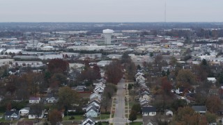 5.7K aerial stock footage of a tall water tower surrounded by warehouse buildings in Lexington, Kentucky Aerial Stock Footage | DX0001_003237