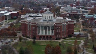 DX0001_003246 - 5.7K aerial stock footage descend while focused on a University of Kentucky library, Lexington, Kentucky